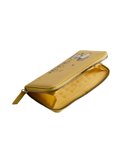 A yellow zip-around wallet with a cartoon rabbit illustration on the exterior and a gold-tone zipper, shown open on a light gray background.
