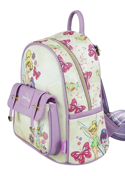 A Disney Tinker Bell themed backpack featuring a cream-colored body with colorful butterfly and fairy prints, accented with lavender purple straps, zippers, and side pocket details.