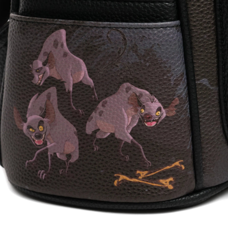 Backpack with embroidered designs of creatures and bones on a textured surface.