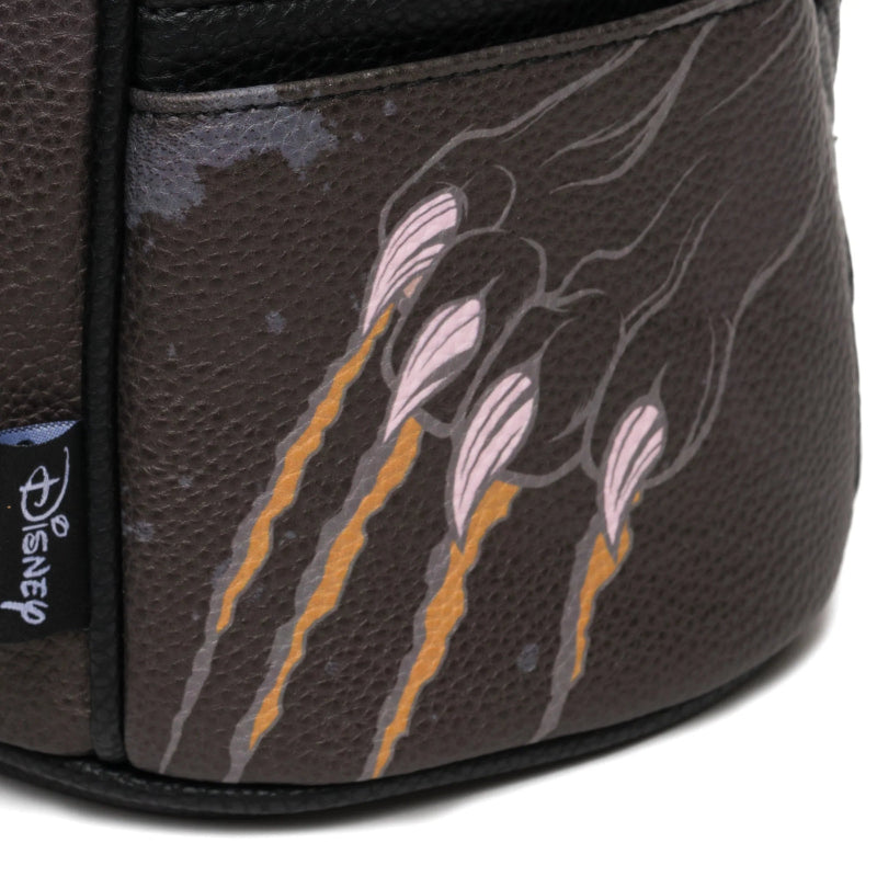 Close-up of a bag with floral design and Disney logo.