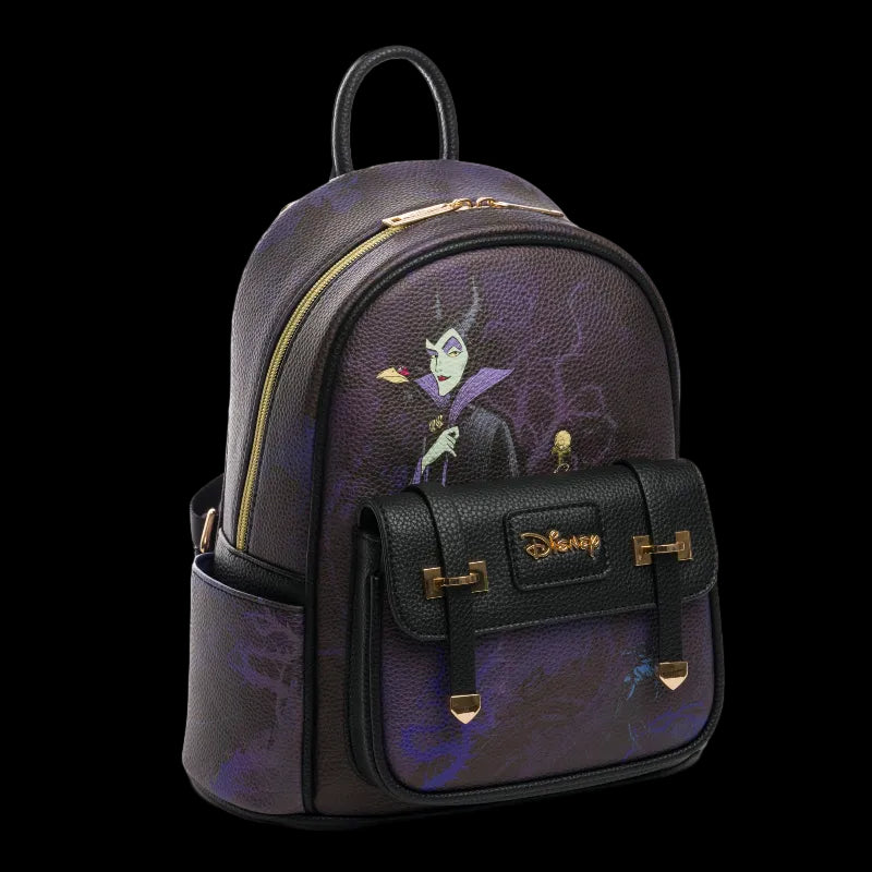 A Disney Maleficent-themed mini backpack in textured purple and black faux leather, featuring a printed illustration of Maleficent on the front pocket, gold-tone hardware, and a Disney logo on the front flap.