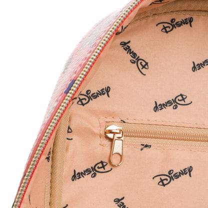 Close-up of a transparent bag with gold zipper and 'Disney' logo print on beige background