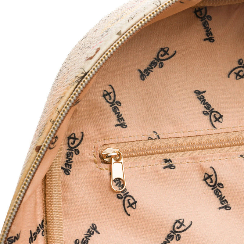 Close-up of a beige bag with gold zipper and Disney logo pattern.