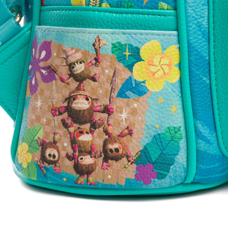 Teal backpack with colorful monkey design on a pocket