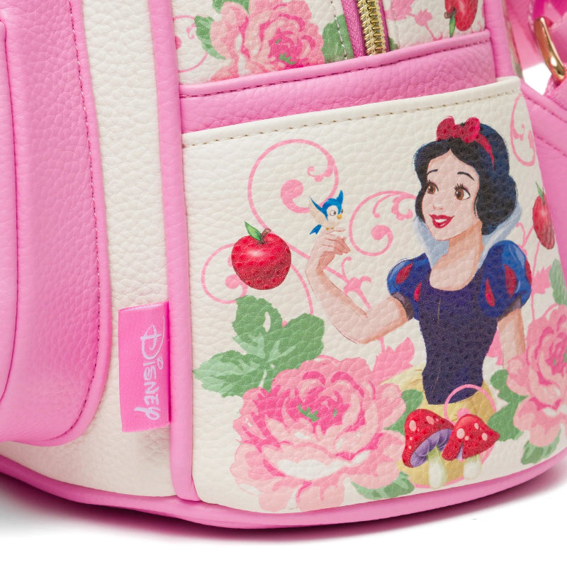 Pink backpack with Snow White design and floral patterns on a white background