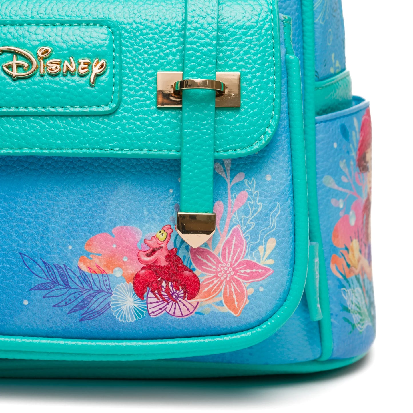 Blue Disney bag with floral designs and gold lock on a white background