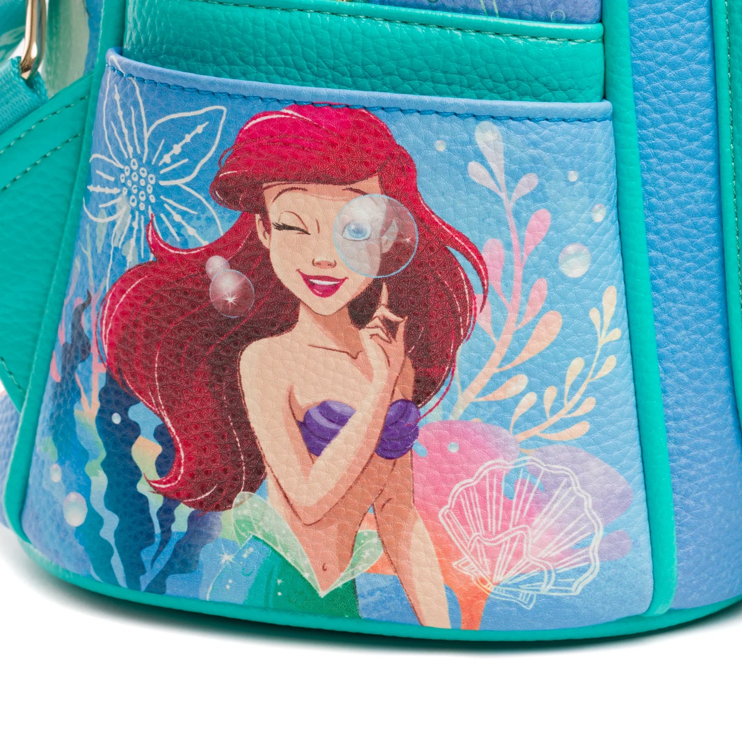 Mermaid character on a colorful bag with blue and green accents