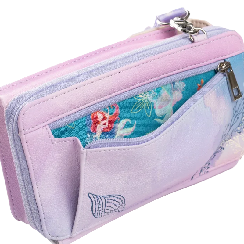 A pastel purple and lavender faux-leather zip-around pouch with a mermaid-themed interior lining visible in the front pocket, shown on a clean white background.