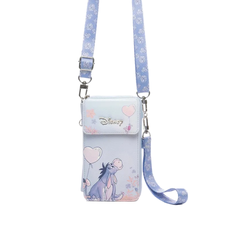 Disney crossbody phone pouch featuring Eeyore, a light blue and lavender color scheme with pink heart accents, and a matching patterned strap on a white background.