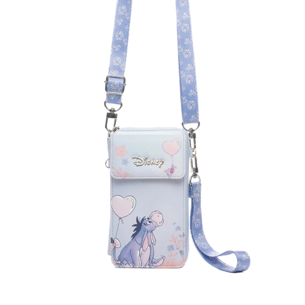 Disney crossbody phone pouch featuring Eeyore, a light blue and lavender color scheme with pink heart accents, and a matching patterned strap on a white background.