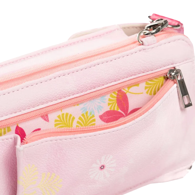 A close-up of a light pink faux-leather pouch with multiple zippered compartments. One compartment features a coral pink zipper and a colorful tropical leaf pattern lining, while the main body has a subtle white floral print.