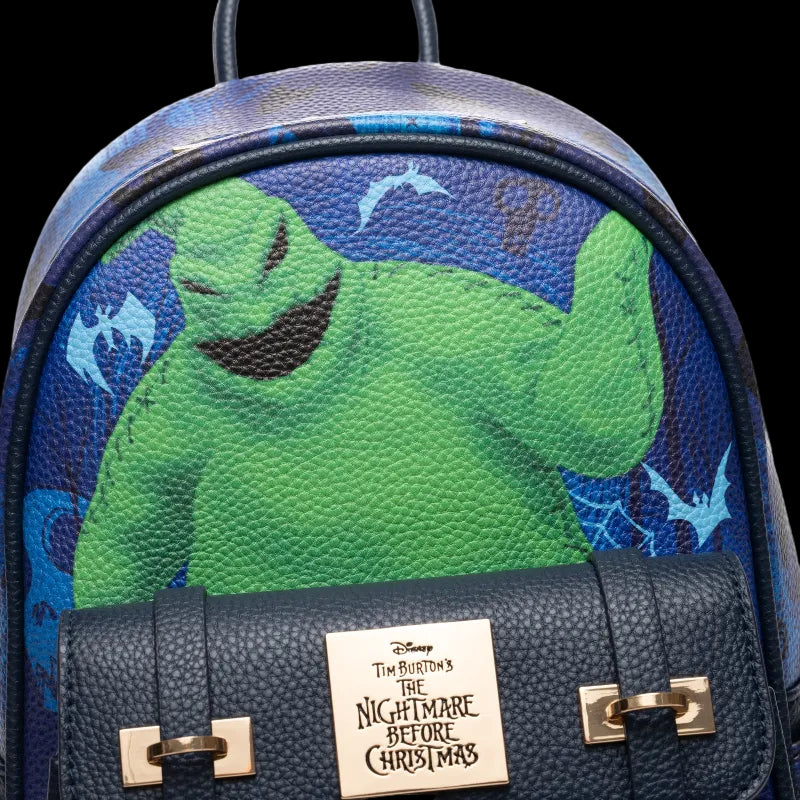 Backpack with a green character design and 'The Nightmare Before Christmas' logo on a blue background