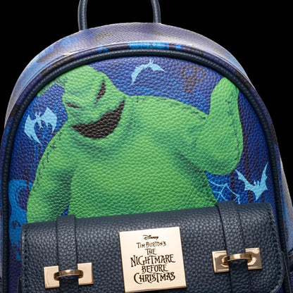 Backpack with a green character design and 'The Nightmare Before Christmas' logo on a blue background