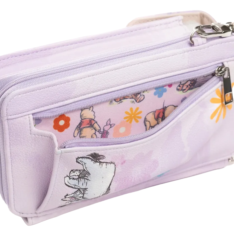 A light purple zippered pouch featuring Winnie the Pooh illustrations on the front pocket and a floral pattern on the inner zippered compartment, shown on a white background.