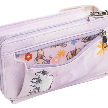 A light purple zippered pouch featuring Winnie the Pooh illustrations on the front pocket and a floral pattern on the inner zippered compartment, shown on a white background.