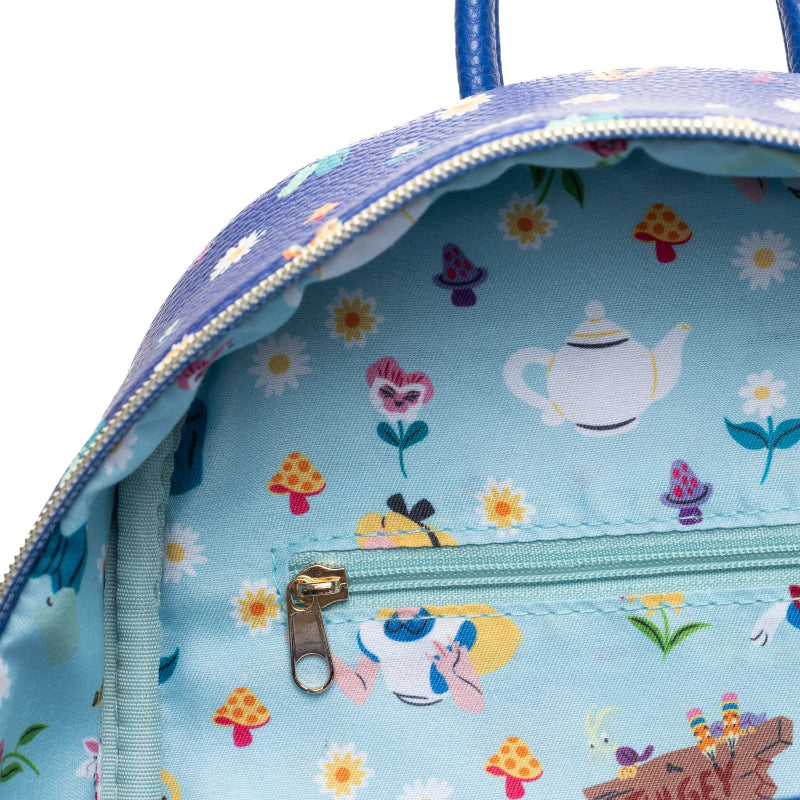 Backpack with a colorful pattern of teapots, flowers, and mushrooms on a light blue background.