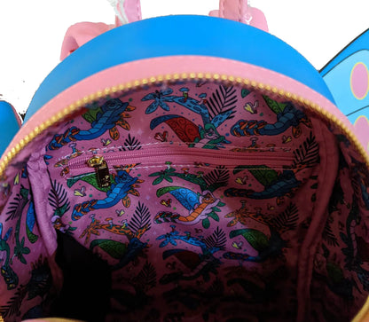 Pink backpack with colorful mermaid pattern on a white background