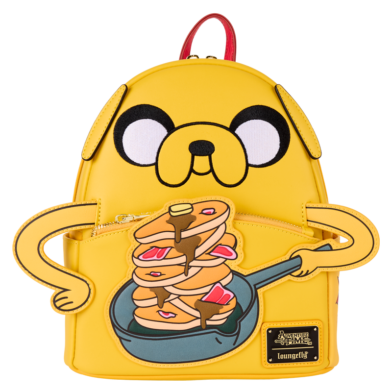 Yellow backpack with cartoon dog design holding pancakes, on a white background