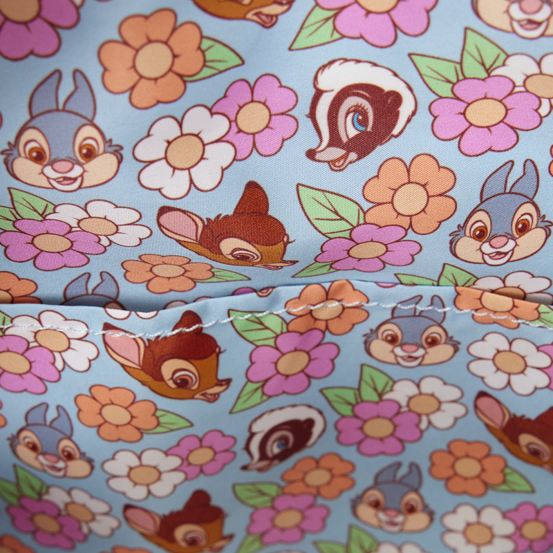Fabric with cartoon characters and flowers on a blue background