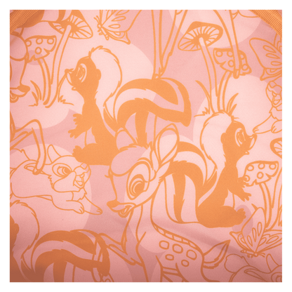 Patterned fabric with orange outlines of animals and plants on a pink background