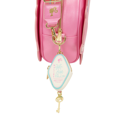 Pink bag with a key-shaped charm on a white background