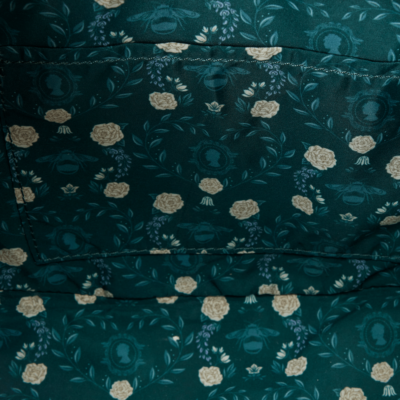 Close-up of a dark green fabric with floral pattern