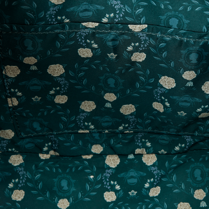 Close-up of a dark green fabric with floral pattern