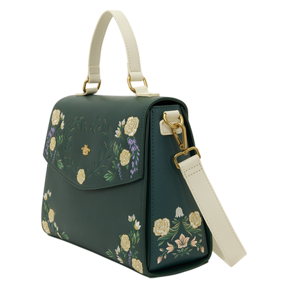 Green handbag with floral embroidery on a white background