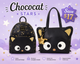 Two black cat-shaped bags with gold accents on a purple background, featuring the brand 'Chococat'.