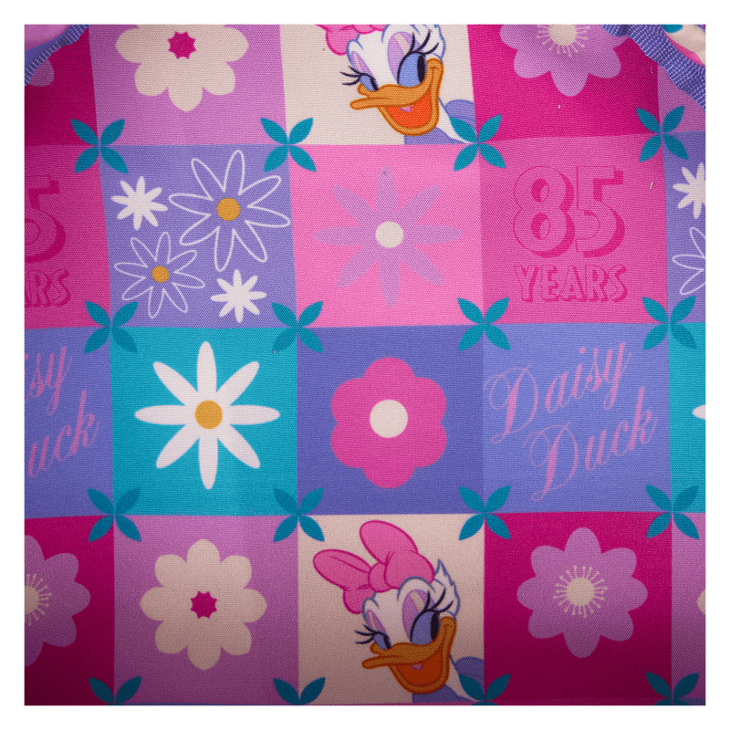 Colorful fabric with Daisy Duck designs and floral patterns on a checkered background.