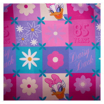 Colorful fabric with Daisy Duck designs and floral patterns on a checkered background.