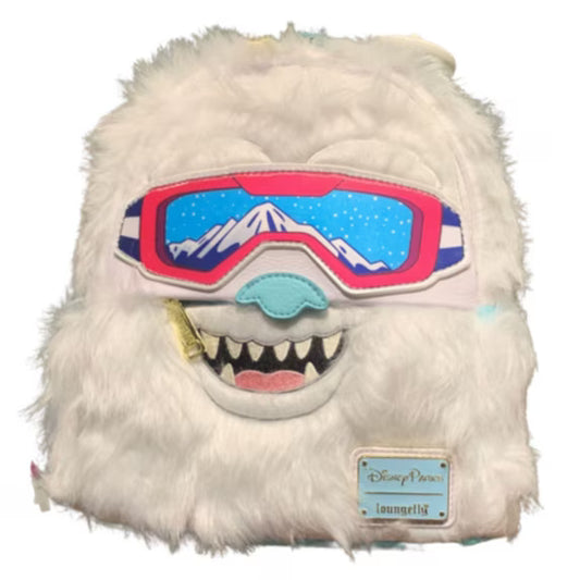 Plush toy resembling a character from Disney with goggles on a white background