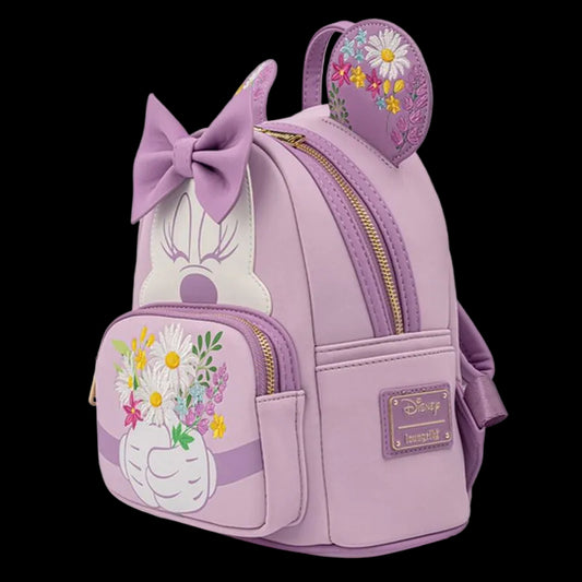 A lavender purple Disney Minnie Mouse backpack featuring Minnie Mouse's face, a large bow, floral daisy embroidery on the ear tab, and a flower vase design on the front pocket.