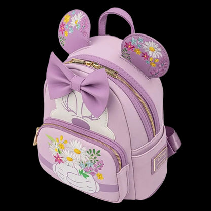 Purple backpack with floral design and bow on a white background