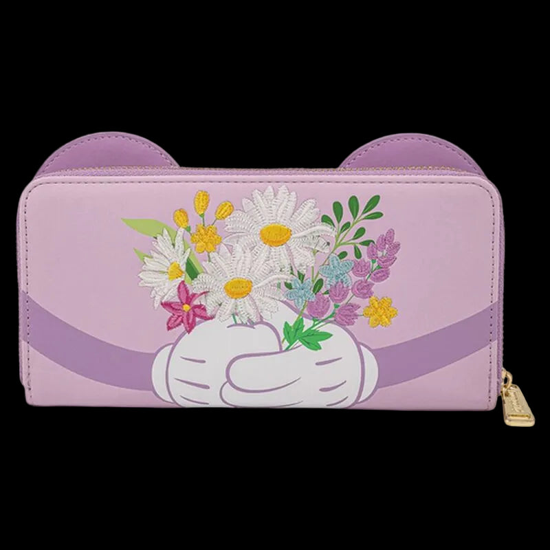 A lavender purple zip-around wallet with cat-ear cutouts on the top, featuring a white gloved hand holding a bouquet of colorful wildflowers. A gold zipper pull is visible on the right side.