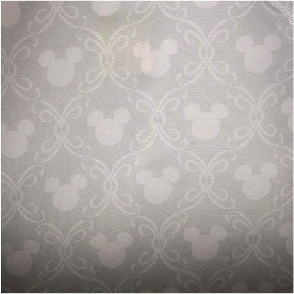 Patterned fabric with repeated design on a gray background