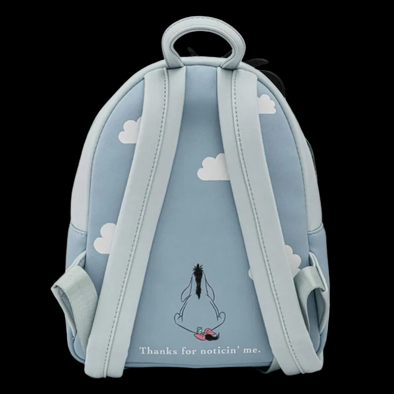 Backpack with cloud design and cartoon character on a light blue background