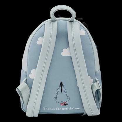 Backpack with cloud design and cartoon character on a light blue background