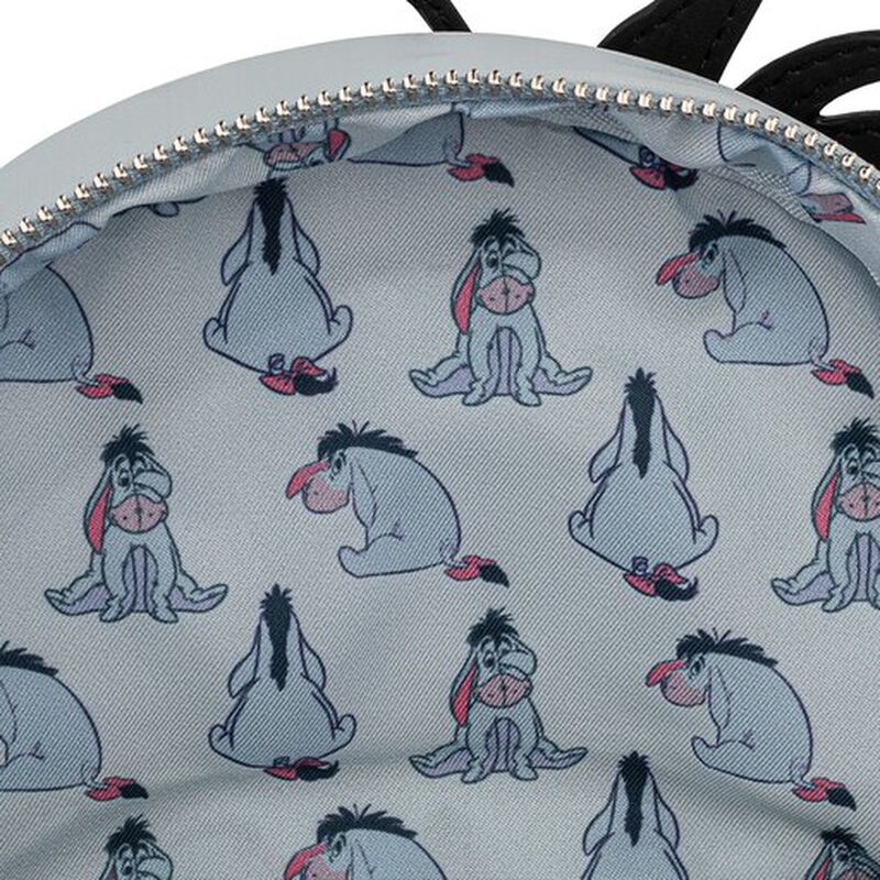 Close-up of a bag with Eeyore pattern on a light gray background