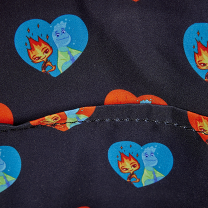 Close-up of a fabric with cartoon character heart designs on a dark background