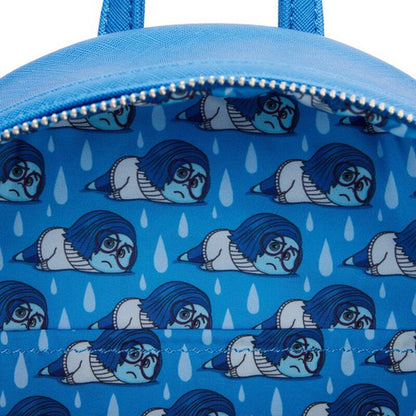 Blue backpack with character pattern and raindrop design