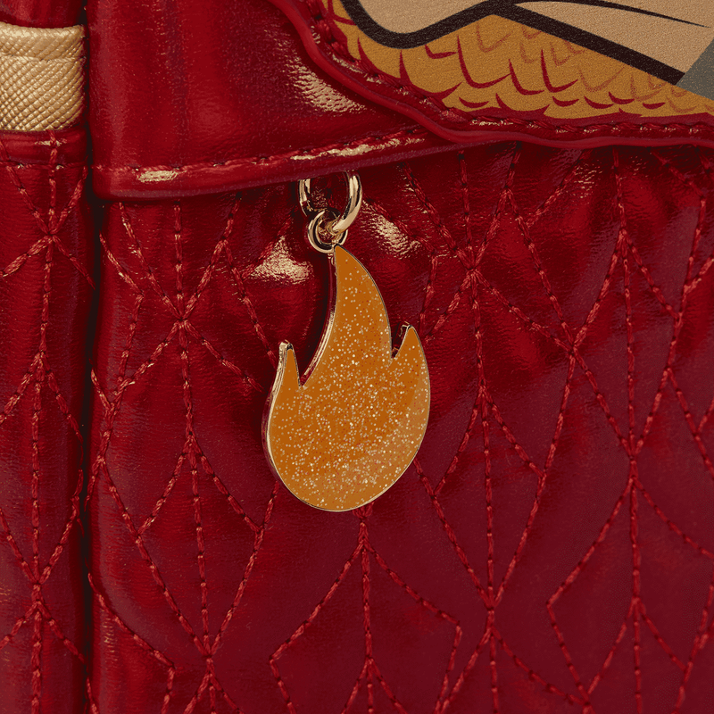 Red textured bag with a gold flame-shaped charm