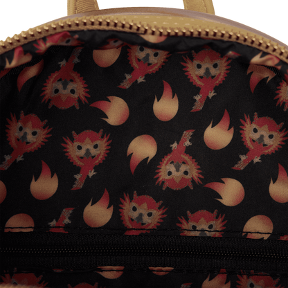 Close-up of a bag with a pattern of cartoon characters and flames on a black background.