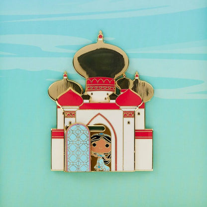 Enamel pin of a castle with a character in front on a light blue background