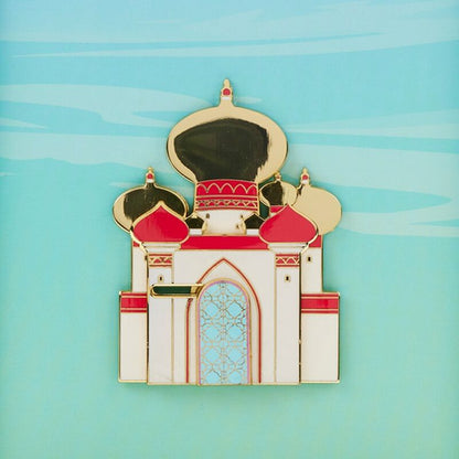 Decorative pin of a building with red and gold accents on a blue background