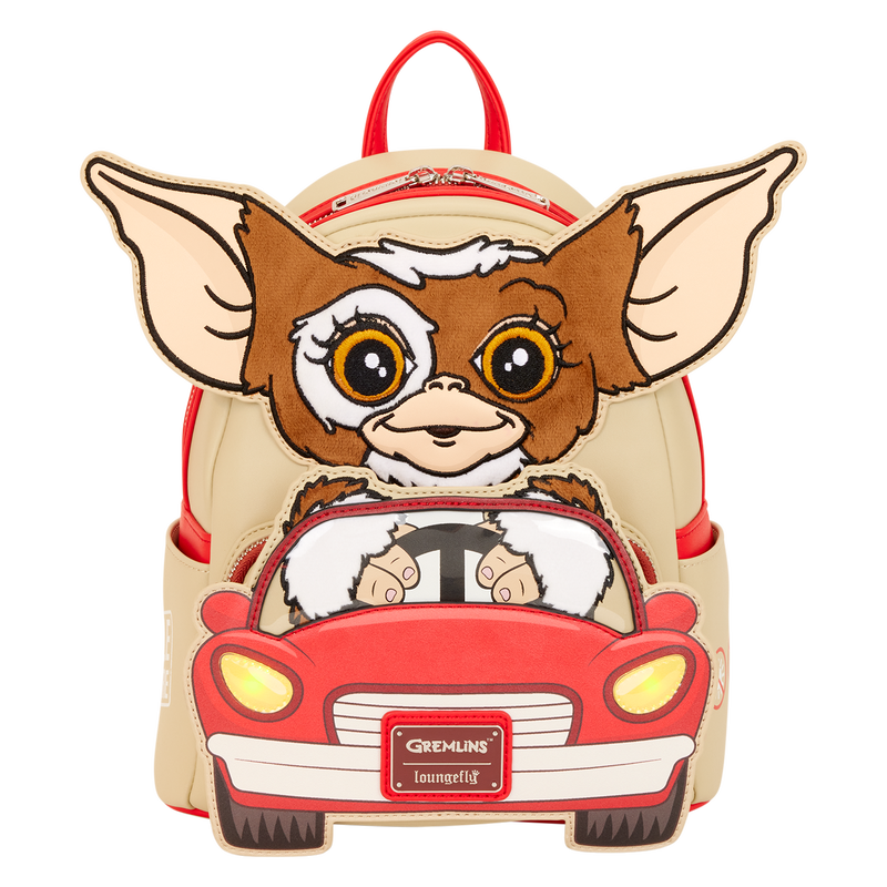 Backpack with a cartoon character driving a car, inspired by Gremlins, on a white background.