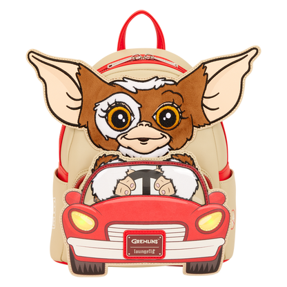 Backpack with a cartoon character driving a car, inspired by Gremlins, on a white background.