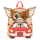 Backpack with a cartoon character driving a car, inspired by Gremlins, on a white background.