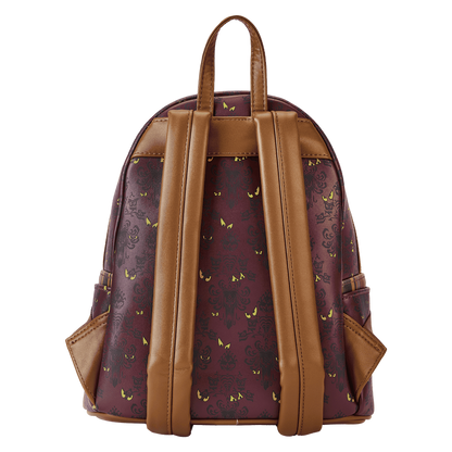 Backpack with brown leather straps and a patterned back panel on a white background