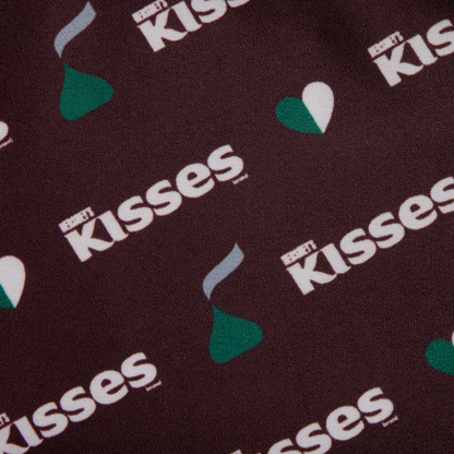 Close-up of Hershey's Kisses logo pattern on a dark background